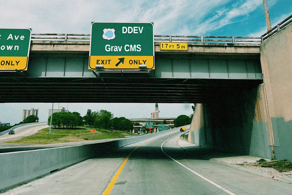 Road exit sign with "Grav CMS" text. Original image by Skyler Smith at Unsplash.com